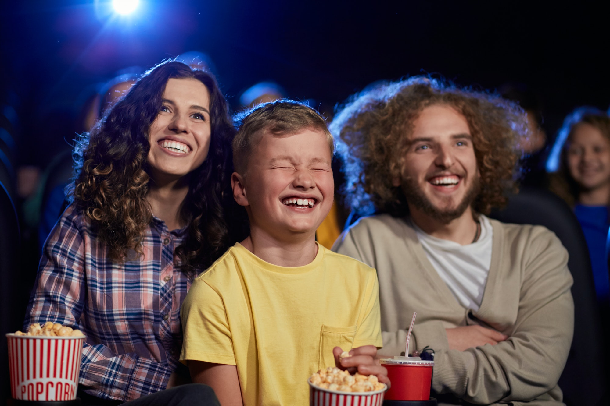 happy-family-with-son-watching-cartoon-in-cinema.jpg